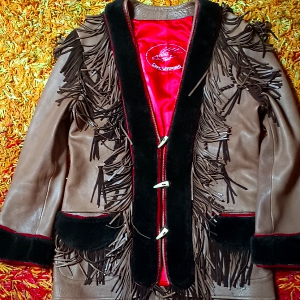 Handmade leather western coat with fringe.